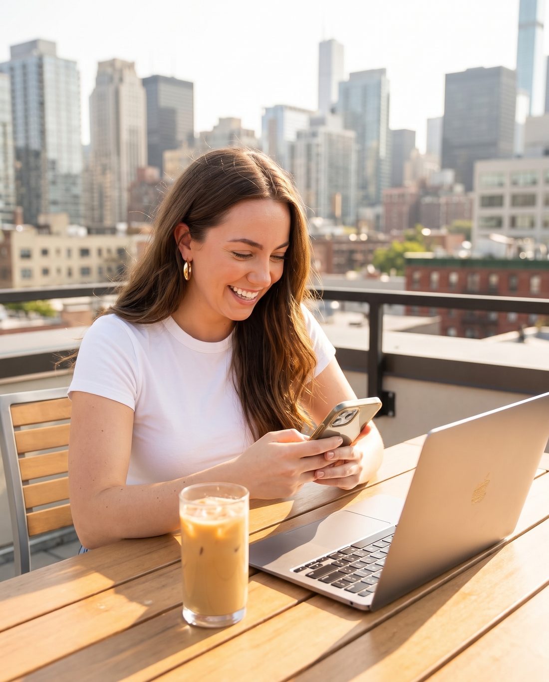 A creator on a rooftop terrace smiling at her phone while her AI twin runs her feed